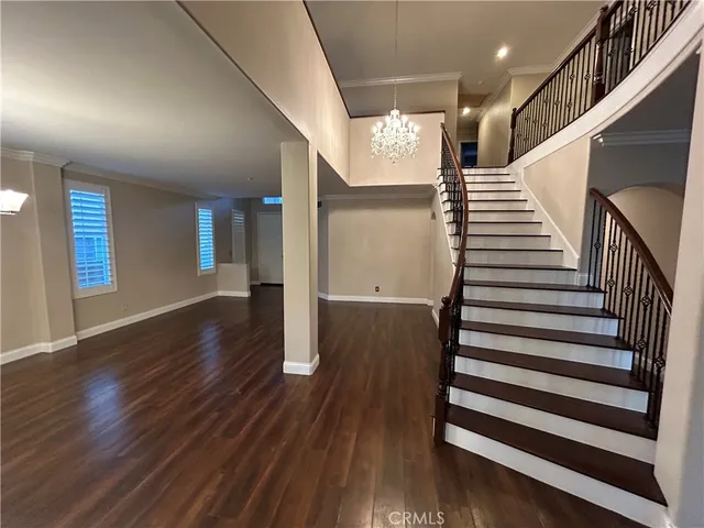 a view of staircase with wooden floor