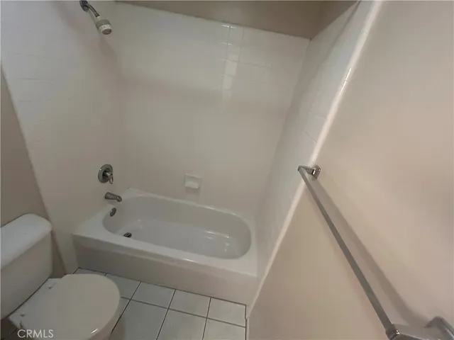 a view of kitchen and hall with a large window