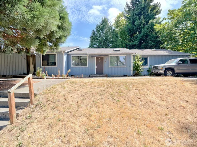 a house with trees in the background