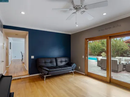 a wooden bench sitting in a room next to a window