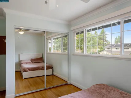 a bedroom with furniture and a window