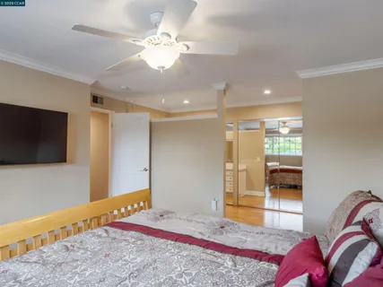 a view of a bedroom with a flat screen tv