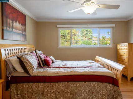 a bedroom with a bed and window