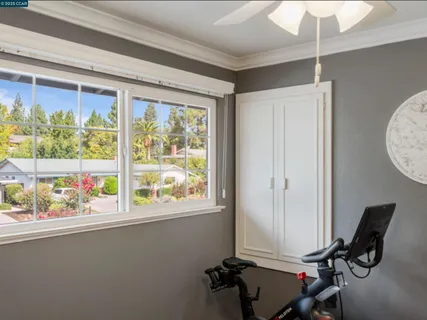 a view of workspace with wooden floor and windows