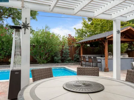 a view of a swimming pool with a patio