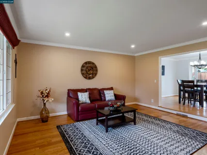 a living room with furniture and a rug
