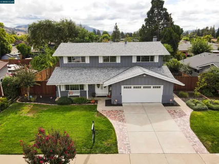 an aerial view of a house with a garden