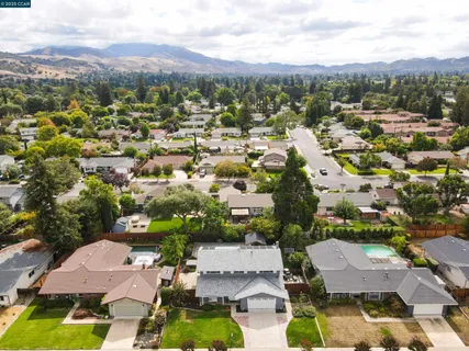 an aerial view of residential houses with outdoor space