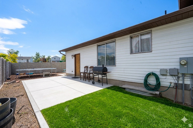 3689 Lasso Loop Circle Magna, UT 84044 - Photo 22 of 26 Ai enhanced concrete backyard