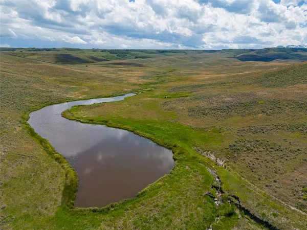 a view of a lake with a yard