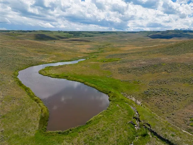 a view of a lake with a yard