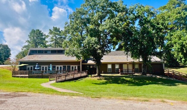 116 Water Oak Livingston, TX 77351 - Photo 6 of 9 a front view of a house with yard and green space
