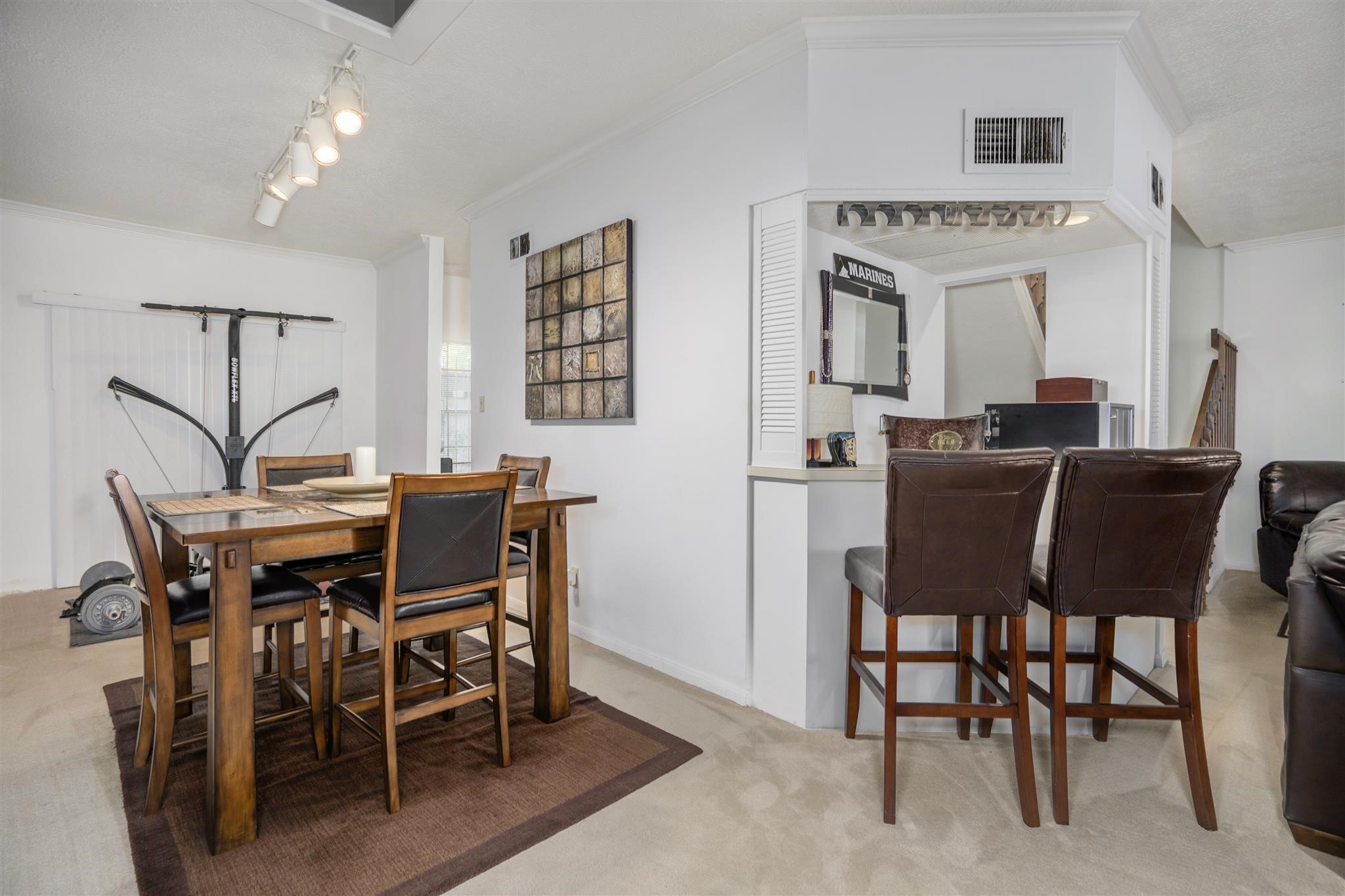 10763 Sandpiper Drive Houston, TX 77096 - Photo 11 of 26 a view of a dining room with furniture