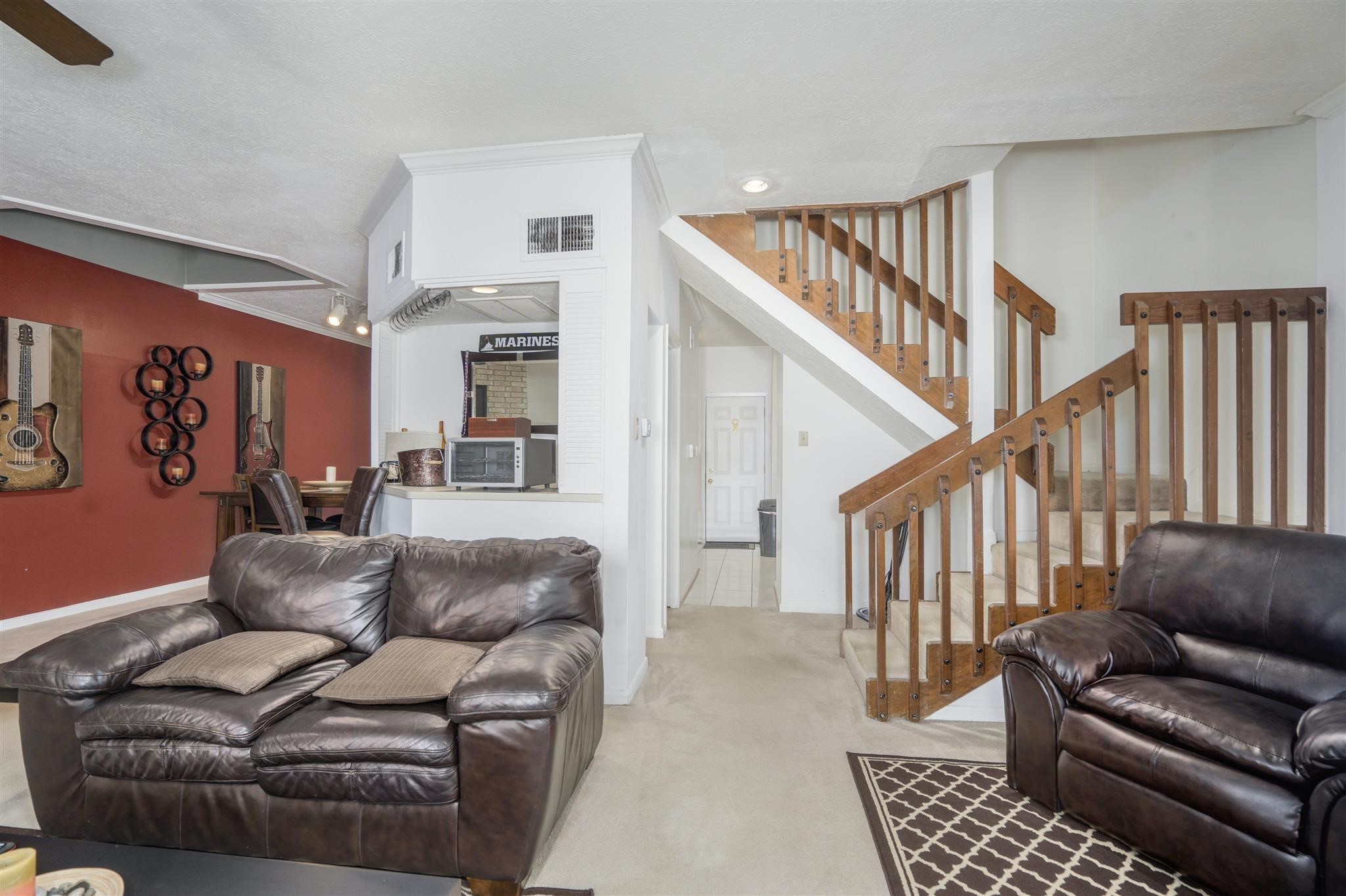 10763 Sandpiper Drive Houston, TX 77096 - Photo 7 of 26 a living room with furniture and a rug