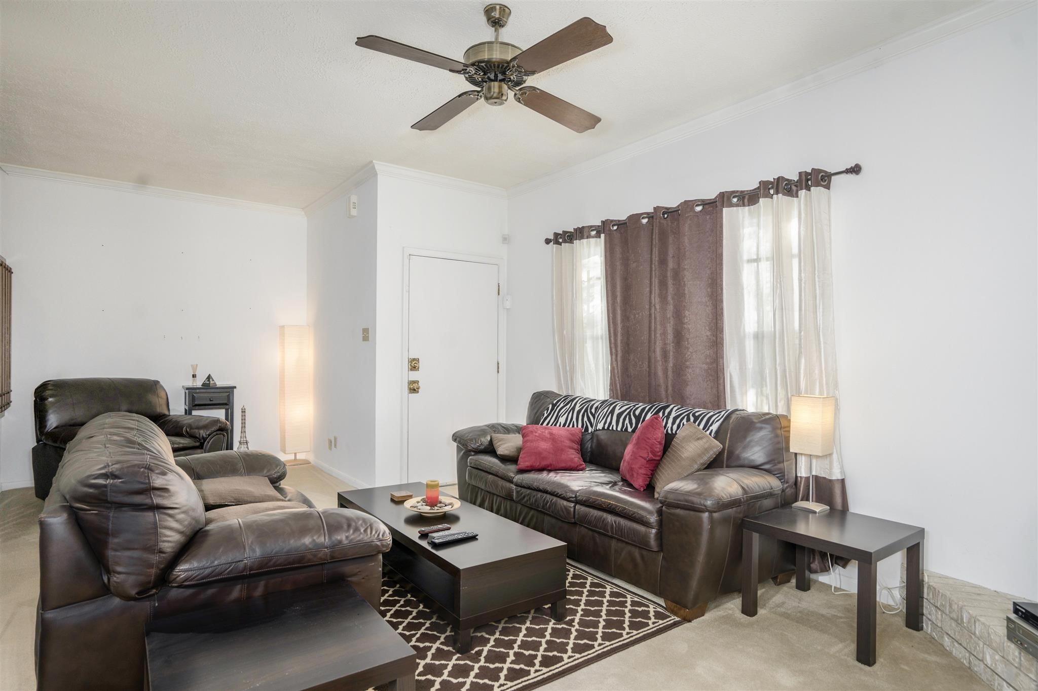 10763 Sandpiper Drive Houston, TX 77096 - Photo 8 of 26 a living room with furniture and a window