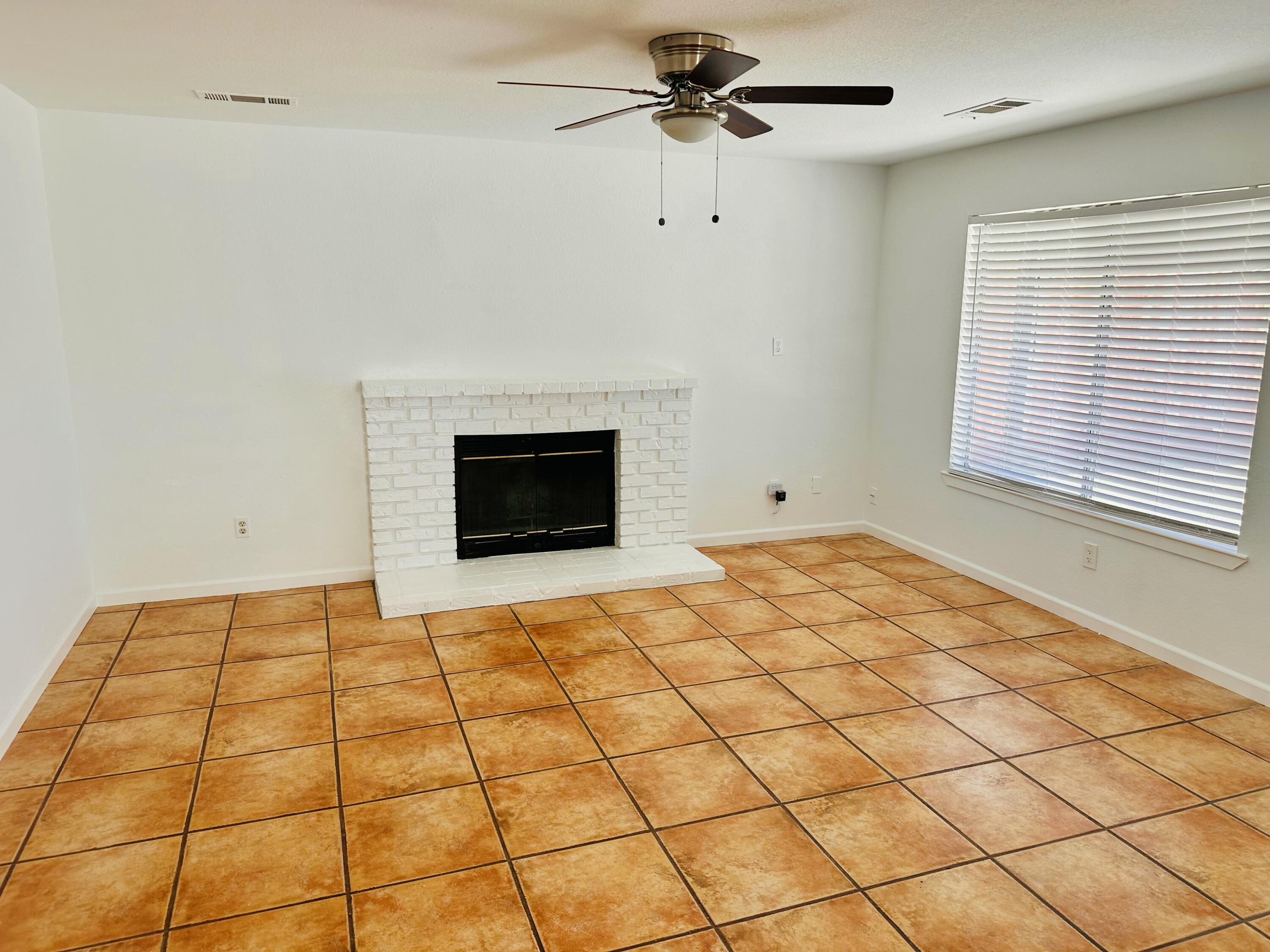30880 Farr Road Visalia, CA 93291 - Photo 5 of 27 a bedroom with a bed and a window