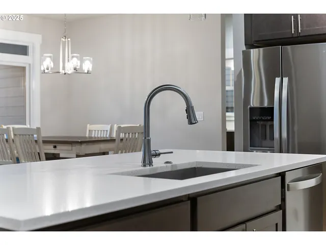 a close view of a sink and a counter top space