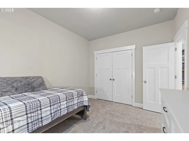 a bedroom with a bed and a cabinets