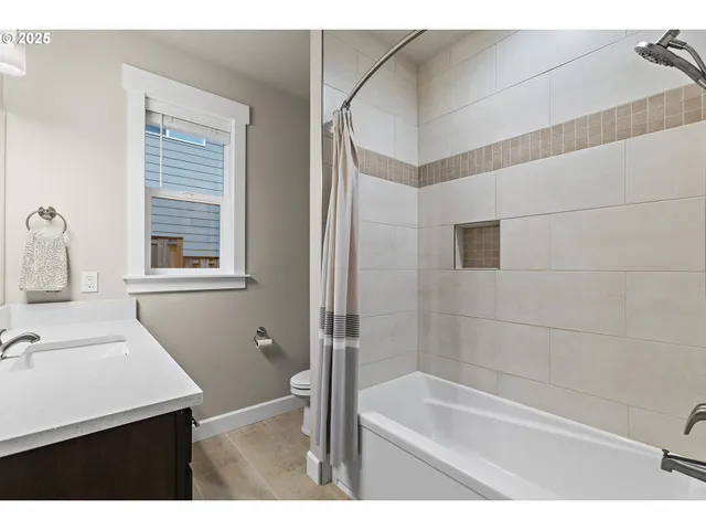 a bathroom with a sink a mirror and a window