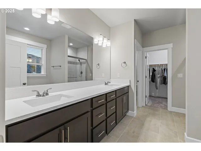 a white bath tub sitting next to a white sink