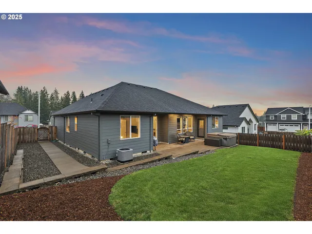 an aerial view of a house with a garden and pool