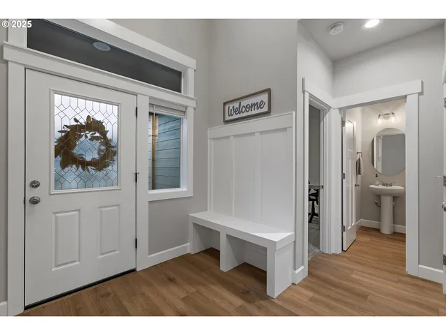 a view of hallway with wooden floor