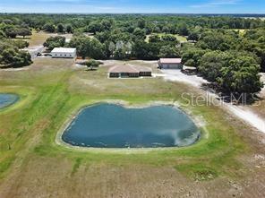 655 South Narcoossee Road St. Cloud, FL 34771 - Photo 1 of 1 a view of a swimming pool with a yard