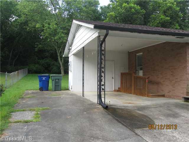 205 Ivey Road Graham, NC 27253 - Photo 2 of 16 Exterior Front. Carport with Storage Room
