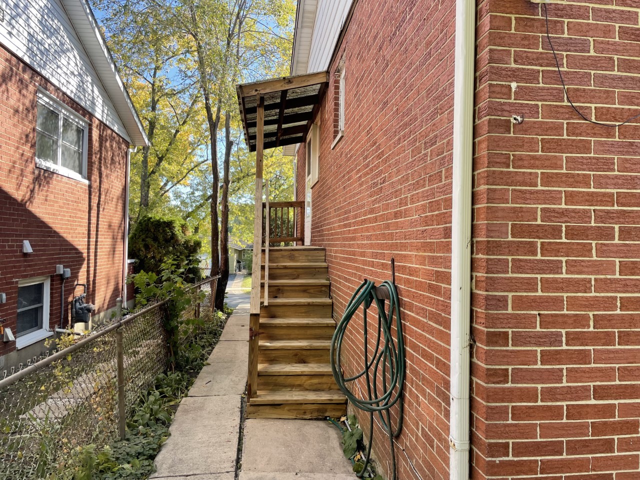 6830 Valley View Road Hanover Park, IL 60133 - Photo 14 of 14 a view of a pathway with a brick wall