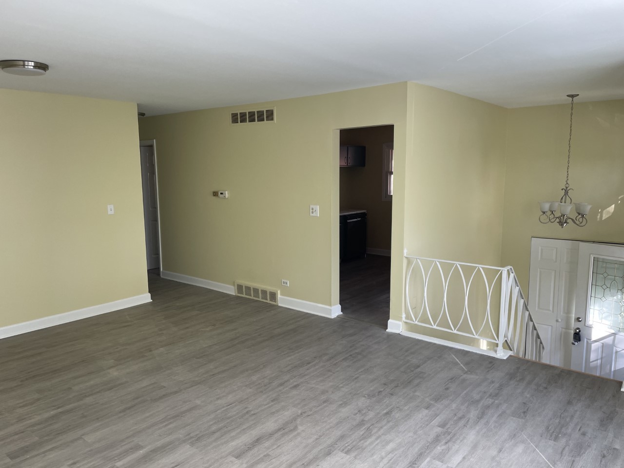 6830 Valley View Road Hanover Park, IL 60133 - Photo 3 of 14 a view of an empty room with wooden floor and a window