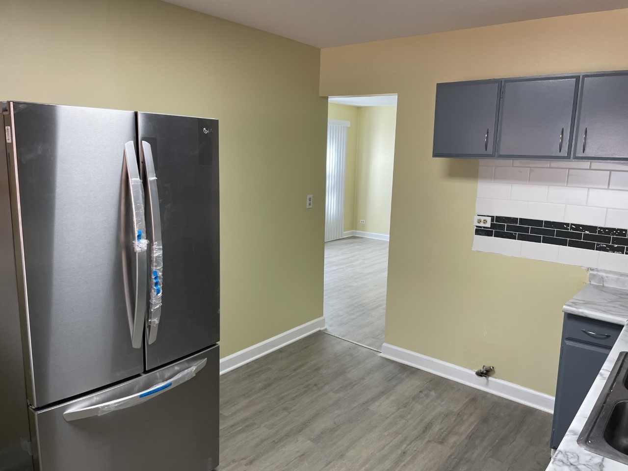 6830 Valley View Road Hanover Park, IL 60133 - Photo 6 of 14 a metallic refrigerator freezer sitting in a kitchen