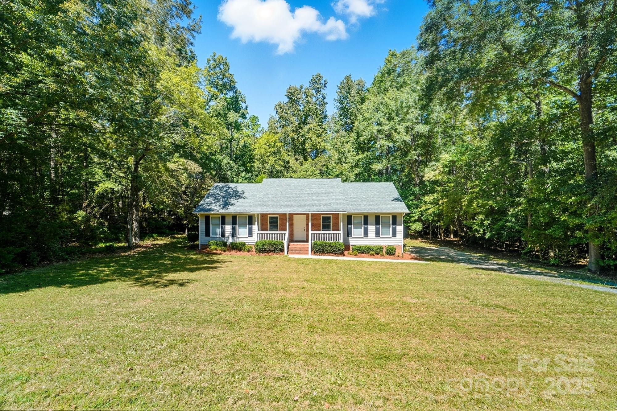 803 Victorian Lane Monroe, NC 28112 - Photo 1 of 46 a front view of a house with a garden