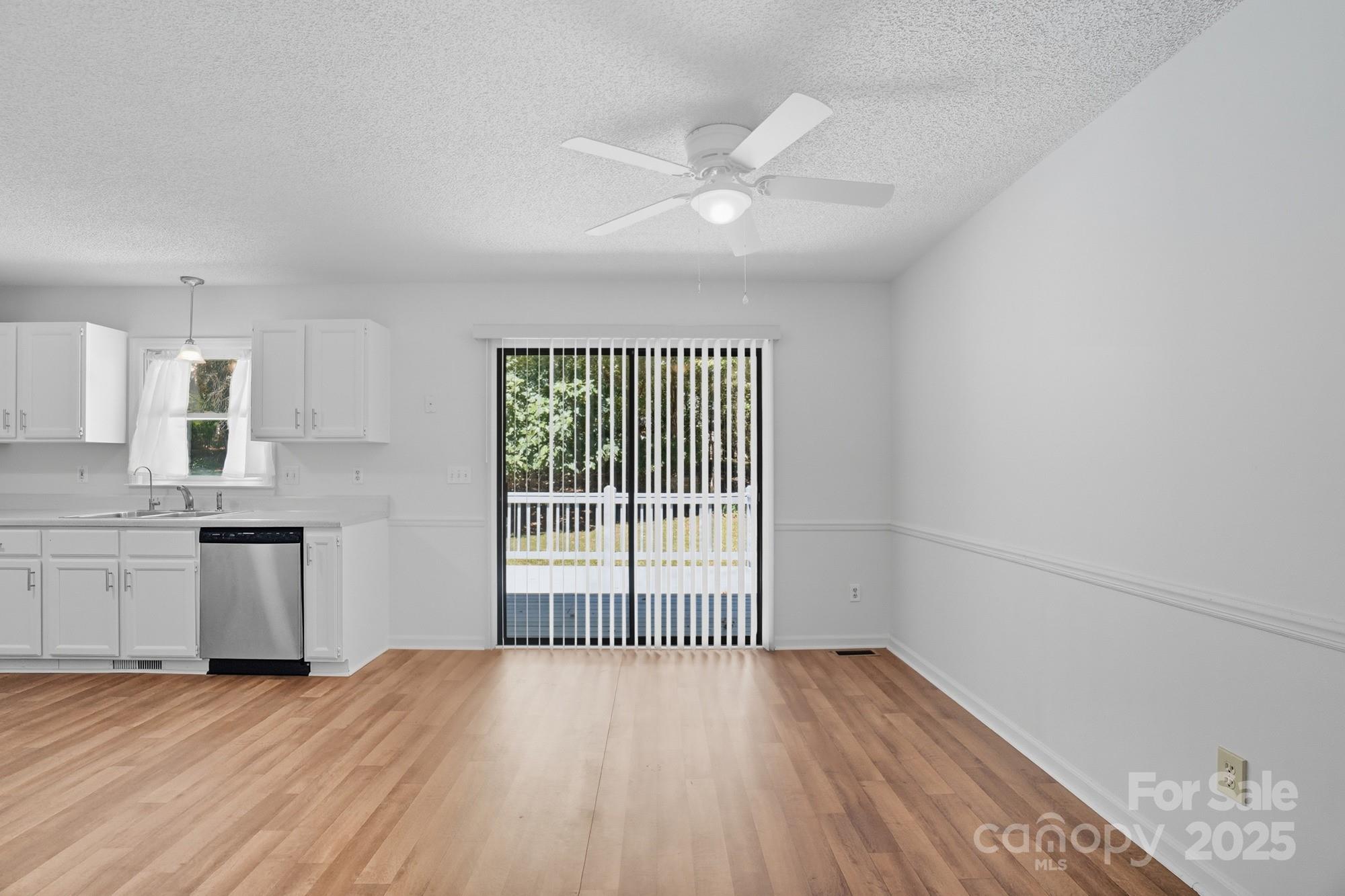 803 Victorian Lane Monroe, NC 28112 - Photo 12 of 46 a view of an empty room with window and wooden floor