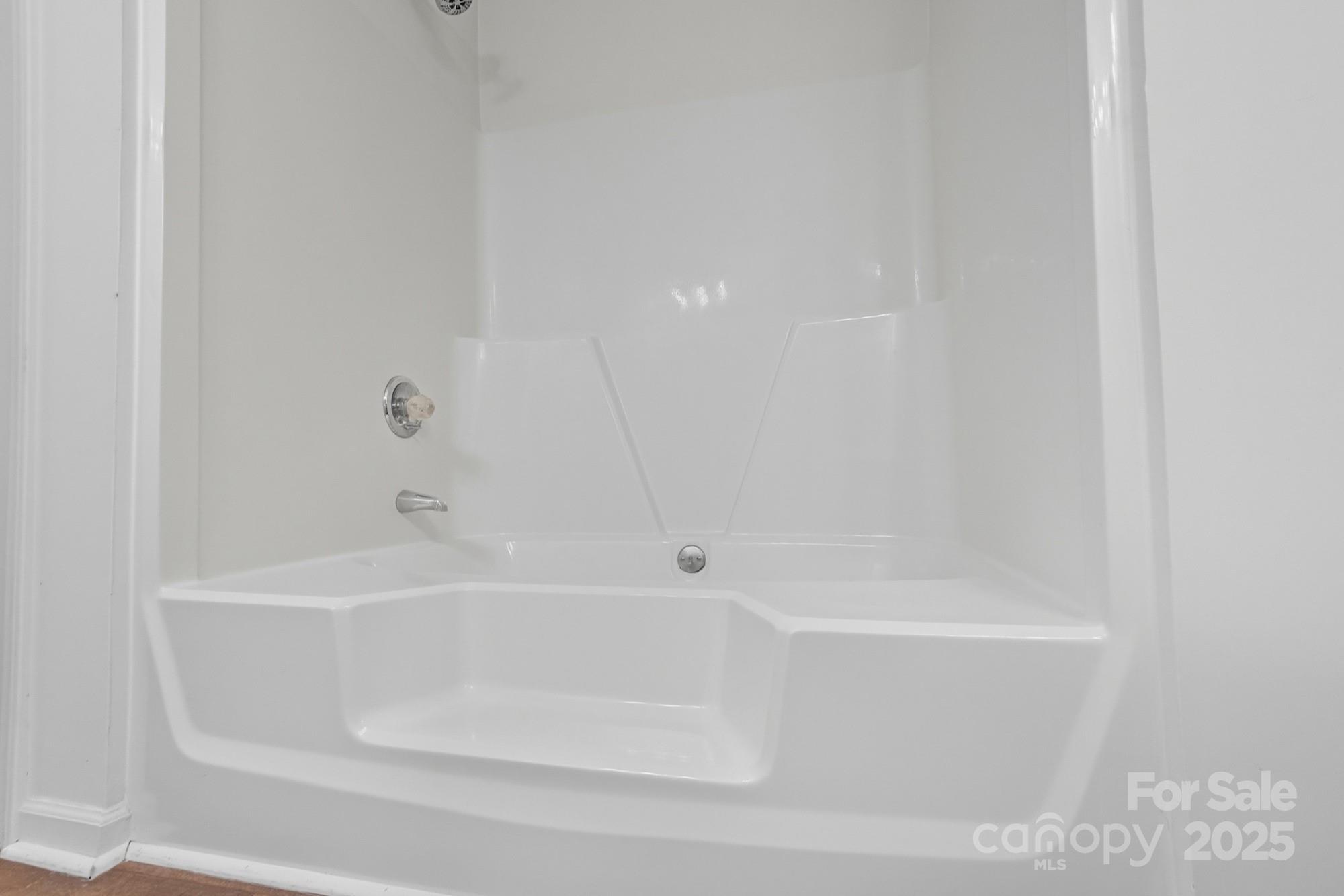 803 Victorian Lane Monroe, NC 28112 - Photo 28 of 46 a close view of a bathtub in bathroom