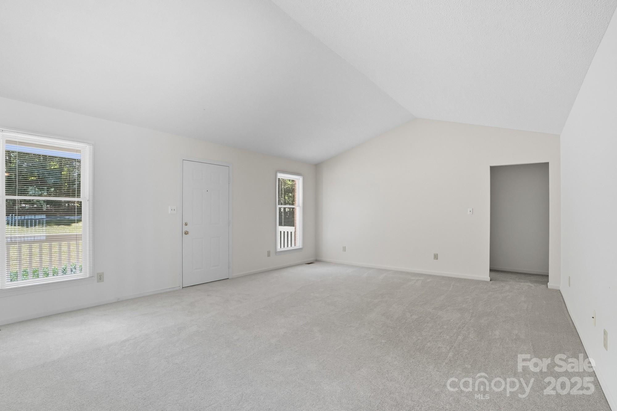803 Victorian Lane Monroe, NC 28112 - Photo 4 of 46 an empty room with windows