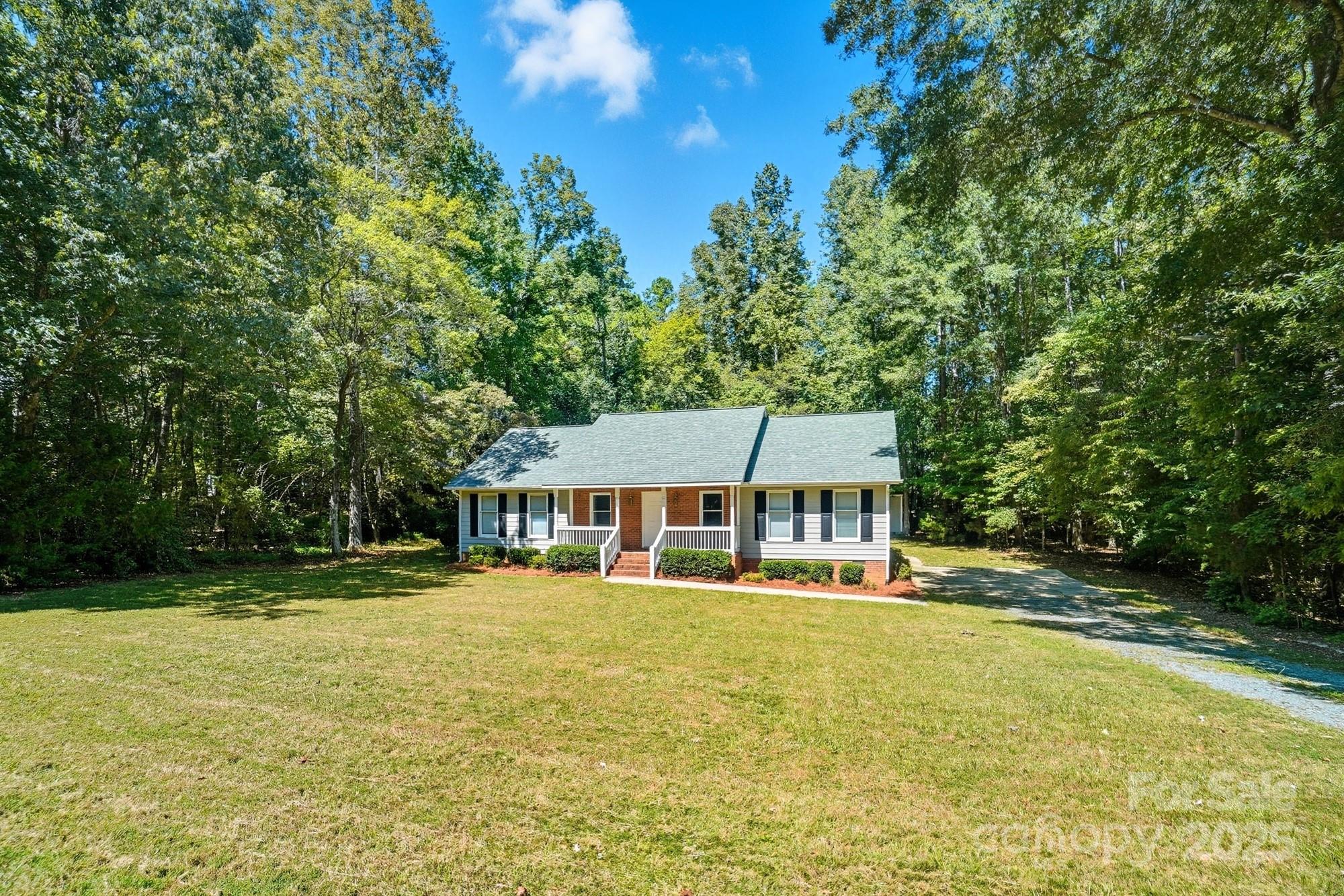 803 Victorian Lane Monroe, NC 28112 - Photo 41 of 46 a front view of a house with a yard table and chairs
