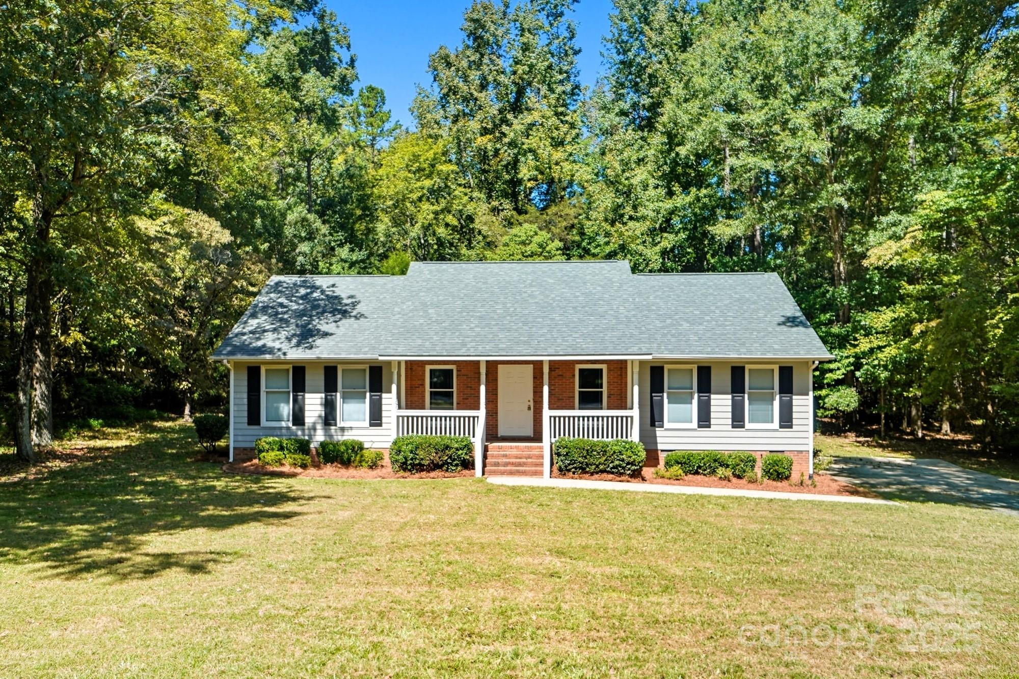 803 Victorian Lane Monroe, NC 28112 - Photo 42 of 46 front view of a house with a yard