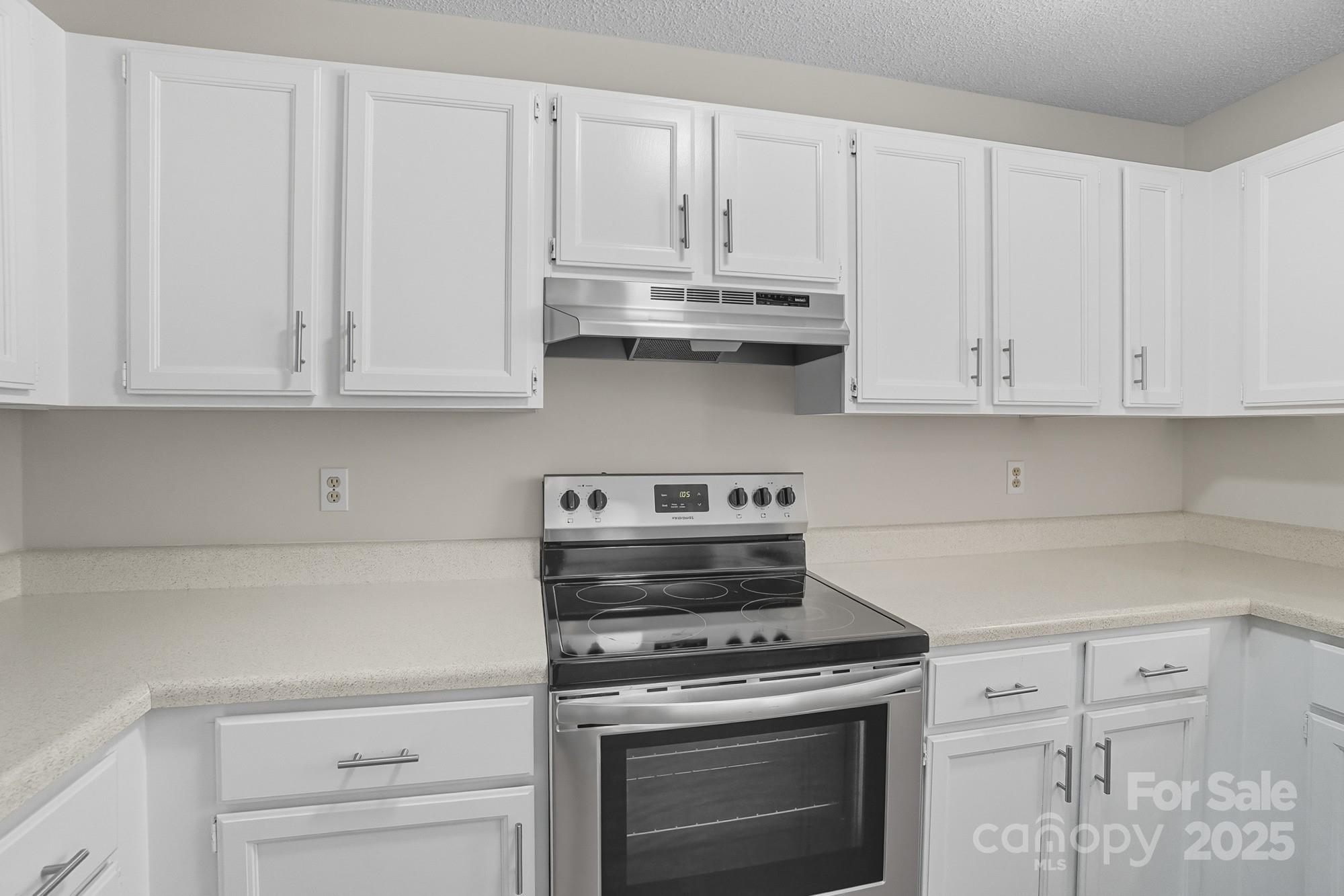 803 Victorian Lane Monroe, NC 28112 - Photo 10 of 46 a kitchen with granite countertop white cabinets and stainless steel appliances
