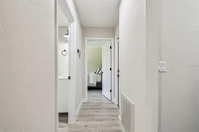 a view of a bathroom from a hallway