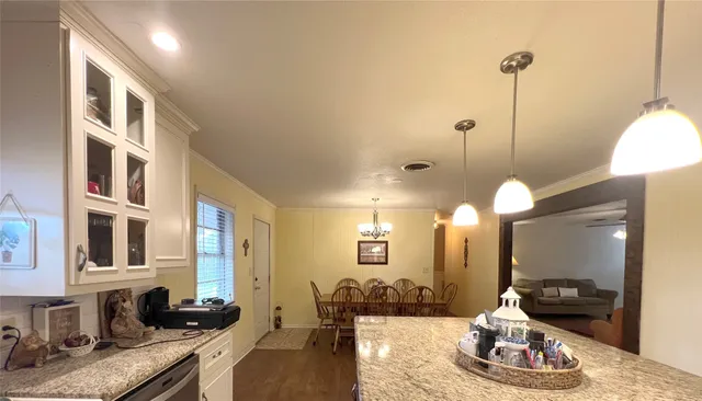 a kitchen with a refrigerator stove and a sink