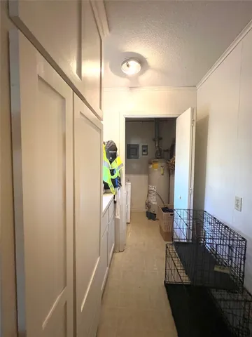 a view of hallway with livingroom and furniture