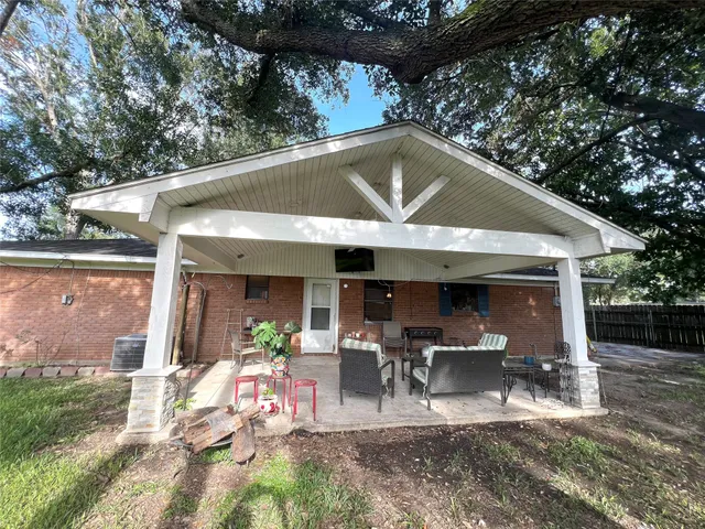 a patio with table and chairs