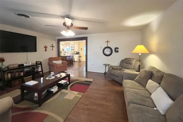 a living room with furniture and a flat screen tv