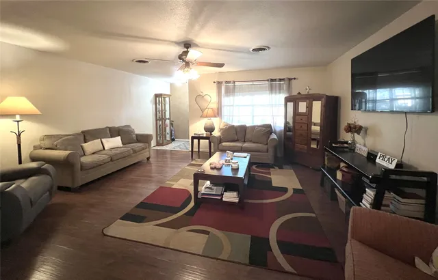 a living room with furniture rug and window
