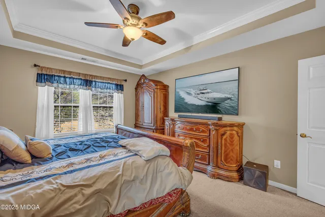 a kitchen with stainless steel appliances granite countertop a refrigerator a sink dishwasher a stove and white countertops with wooden floor