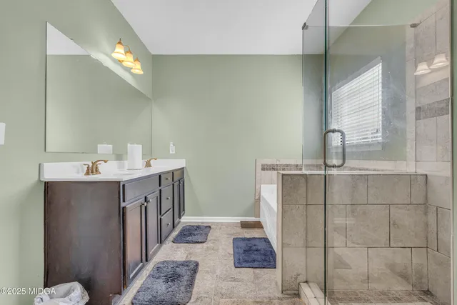 a kitchen with granite countertop a sink and cabinets