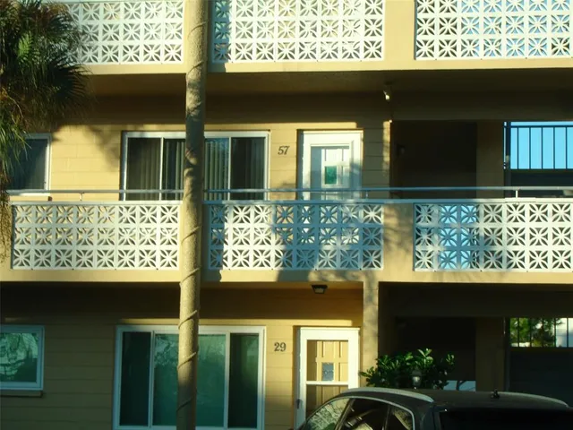 a view of a door of the house with a large window