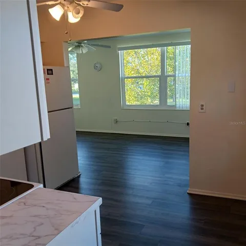 a view of kitchen with wooden floor