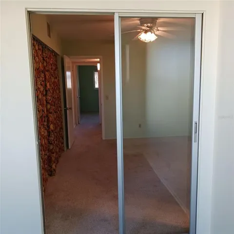 a view of a hallway with closet