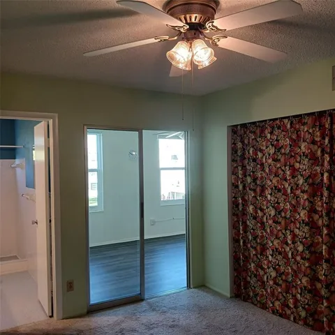 wooden floor in an empty room with a mirror